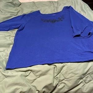 3/4 sleeve dark blue top with black embellishments at neck